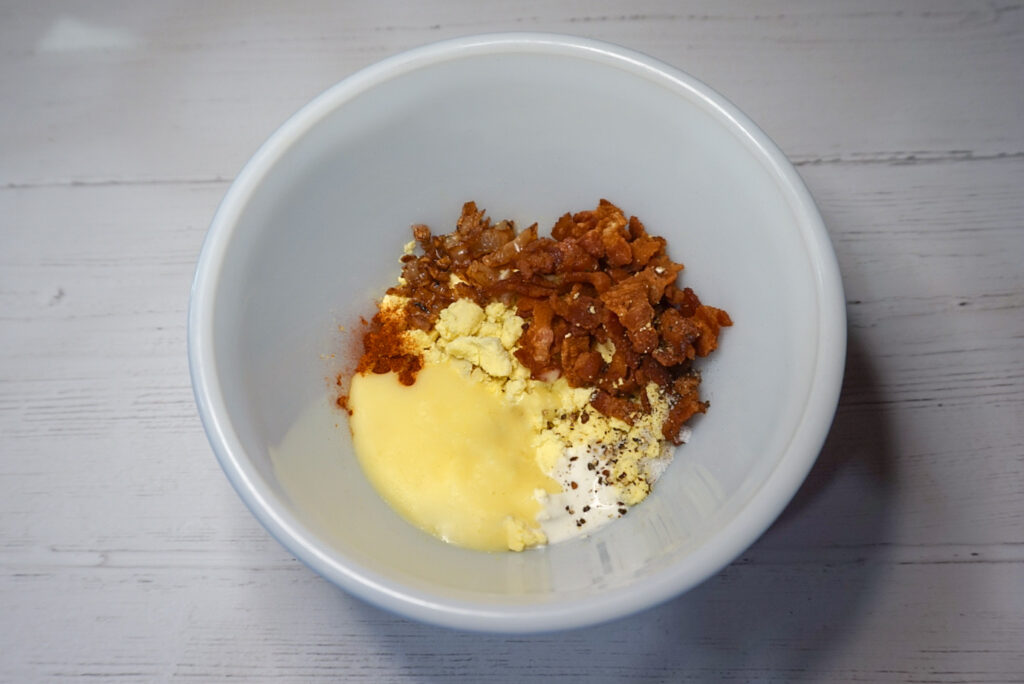A bowl full of  all the ingredients to mix together for the egg yolk part.