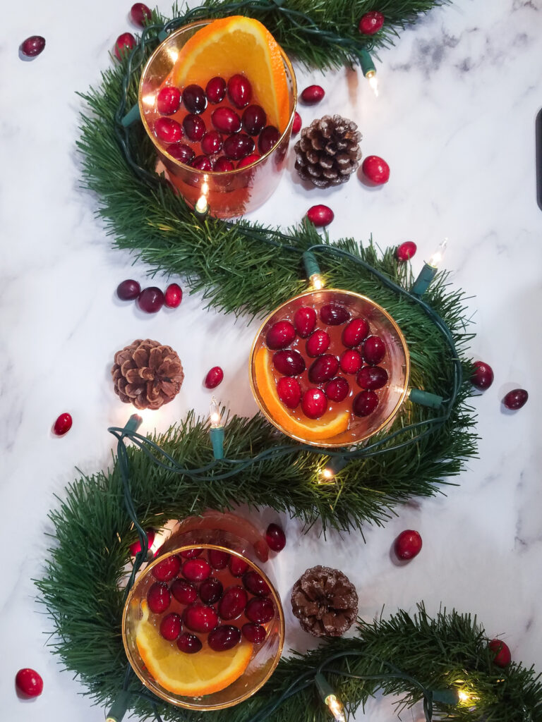 Three glasses full of Sparkling Cranberry Orange Sangria

