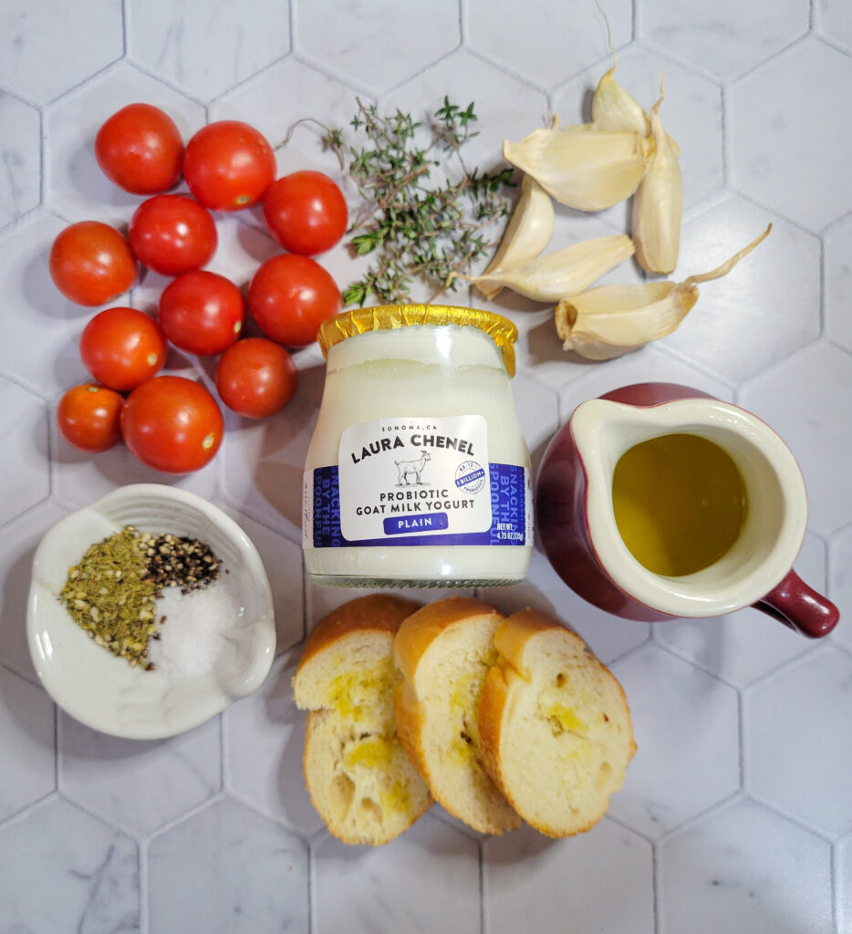 All of the ingredients needed to make za'atar labneh tomato crostinis.