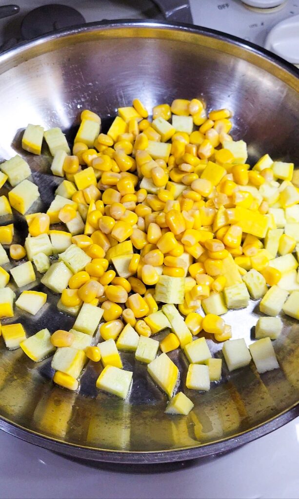 Sautéing the corn and squash for the salsa on the tacos. 