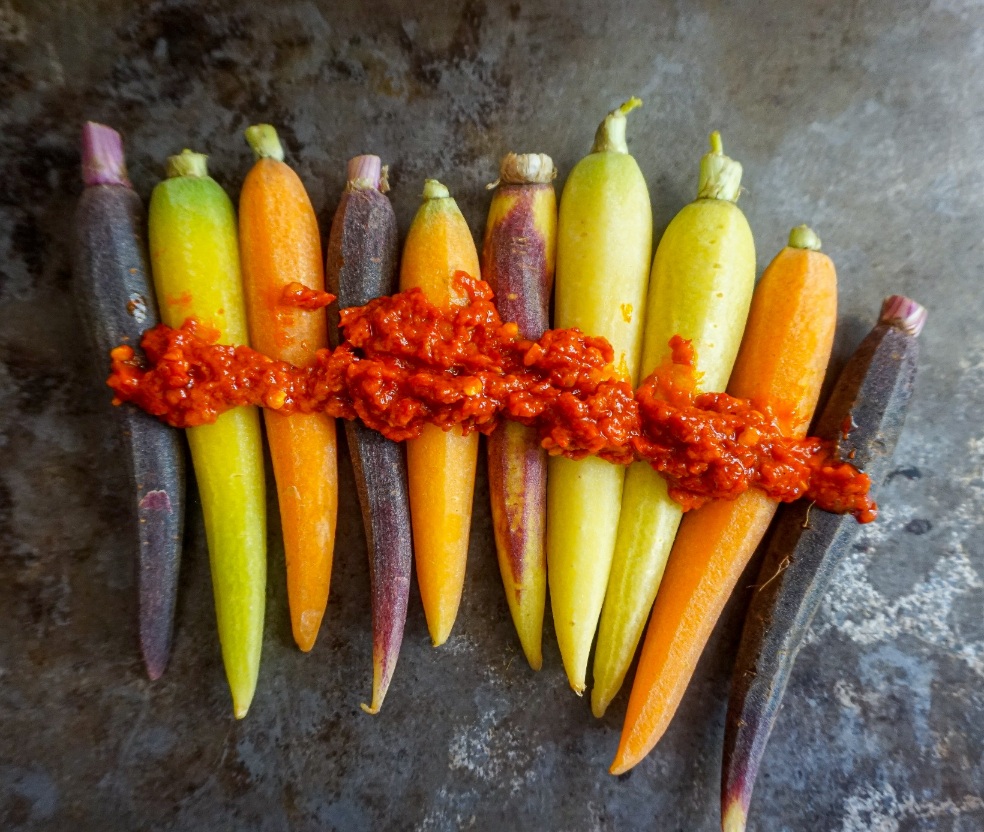Rainbow carrots with harissa paste spread on top. 