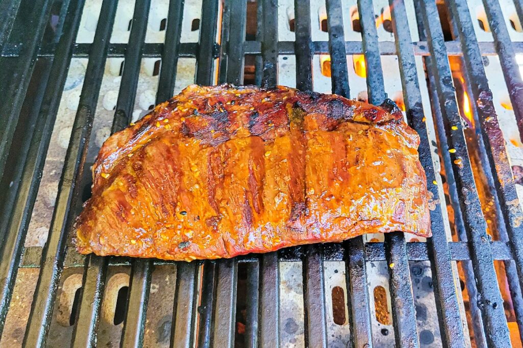 Shot of the finished flank steak on the grill.