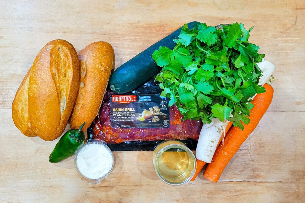 All of the ingredients to make a grilled banh mi sandwich.